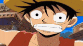 monkey d luffy from one piece is wearing a straw hat and making a funny face