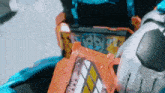a close up of a robot holding a card that says ' i 'm sorry ' on it