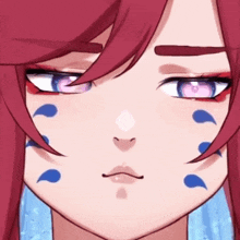 a close up of a girl 's face with red hair and blue tears on her face .