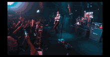 a band called whiskey is performing in front of a crowd