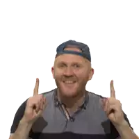 a man wearing a blue hat and a striped shirt points upwards