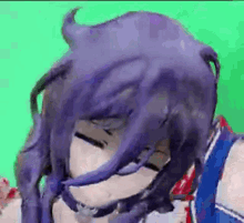 a close up of a person 's face with purple hair on a green background .