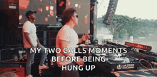 two men are playing music in front of a large screen with the words my two calls moments before being hung up