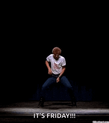 a man is dancing on a stage with the words `` it 's friday ! ''