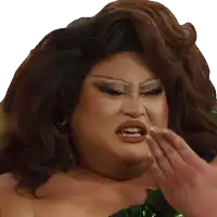 a close up of a drag queen covering her mouth