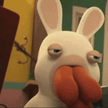 a cartoon rabbit is eating a carrot and making a face .