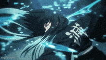 a person in a black jacket with chinese writing on it is floating in the water .