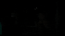 a teddy bear with glowing eyes is in the dark