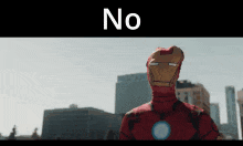 a man in an iron man costume is standing in front of a city skyline with the word no above him