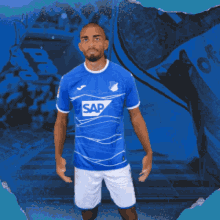 a man in a blue shirt with sap on it