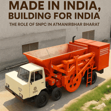 an orange and white truck with snpc on the side