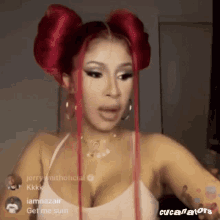 cardi b is wearing red hair and a white tank top .