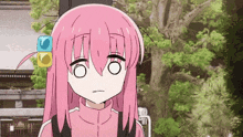 a cartoon girl with pink hair is making a funny face .