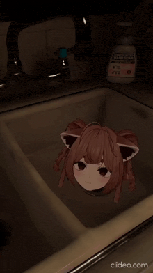 a picture of a girl in a sink with a bottle of hand soap in the background
