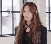 a woman wearing headphones with a question mark above her
