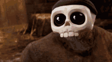 a cartoon skeleton wearing a black hat and a beret