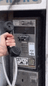 a phone booth has a sticker on it that says at & t $ 91