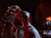 a woman in a bloody costume is standing in front of fire