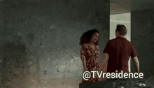 a man and a woman are standing next to each other with the words @tvresidence written below them
