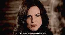 a woman is looking at the camera and saying `` don 't you dare go near my son '' .