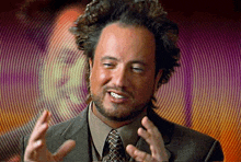 a man in a suit and tie with his hands out