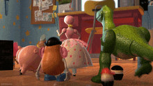 a toy story scene with mr potato head holding a sword