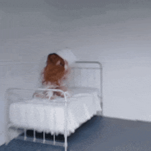 a blurred image of a woman laying in a bed