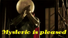 a man covering his face with a crystal ball and the words " mysteric is pleased " below him
