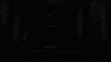 a close up of a person 's face with a black background