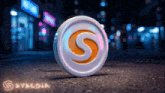 a coin with the letter s on it sits on a street