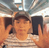 a man wearing glasses and a baseball cap says hola see you soon in october in his caption
