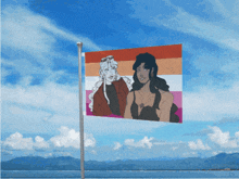 a lesbian flag with two women on it is flying in the wind