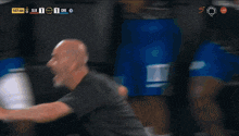 a blurred image of a soccer game with the score 1 to 1