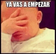 a baby covering his face with his hand with the words ya vas a empezar written above him