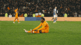 a soccer player with the number 9 on his jersey is being high fived by another player