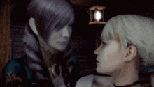 two women are standing next to each other and looking at each other in a dark room .