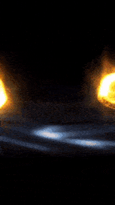 a glowing object in the dark with a black background
