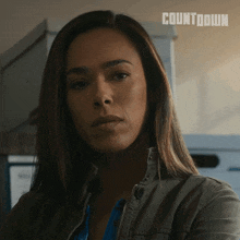 a close up of a woman 's face with the word countdown on the bottom right
