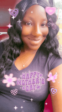 a woman wearing a happy mother 's day shirt