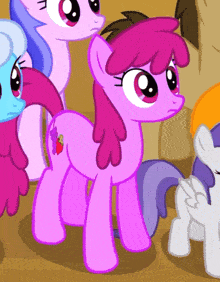 a pink pony with a red strawberry on its butt