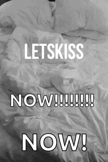 a black and white photo of a bed with the words letskiss now
