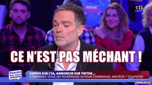 a man in a suit says ce n'est pas mechant !