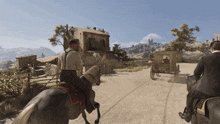 a man riding a horse in front of a building