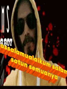a man wearing sunglasses and a yellow hoodie says " assalamualaikum "