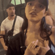 a man and a woman are standing next to each other in a blurry photo
