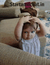 a little girl sitting on a couch with starttamilchat.in written on the bottom right
