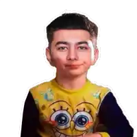 a young boy is wearing a yellow spongebob sweater