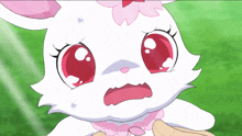 a white rabbit with pink eyes and a flower on its head