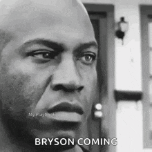 a black and white photo of a man with a surprised look on his face and the words bryson coming .