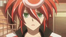 a red haired anime character with green eyes looks at the camera